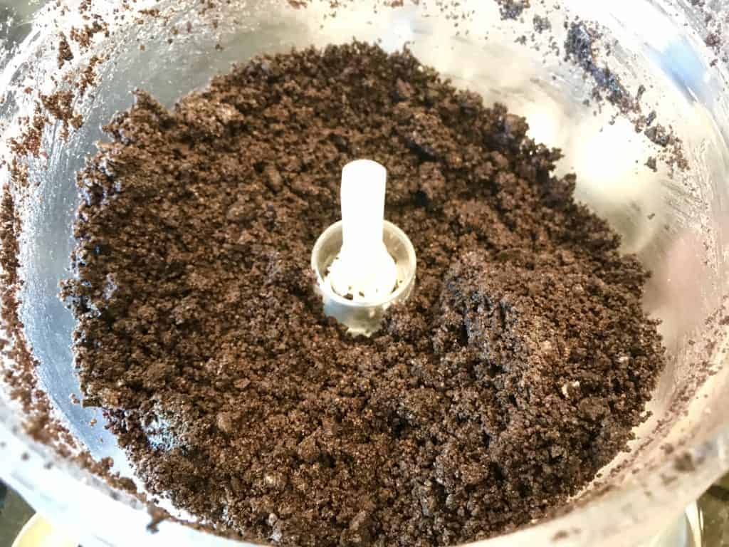 Crushed up Thin Mints and non-dairy butter in a food processor