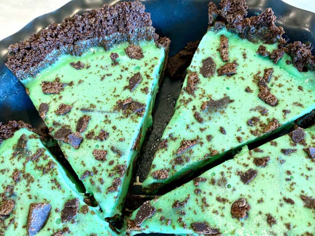 5-Ingredient Thin Mint Pie cut up in a pan